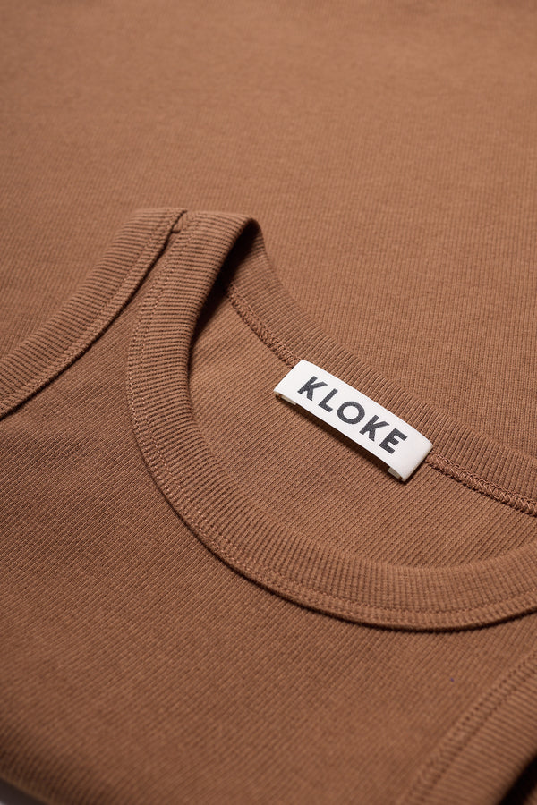 Close-up of ribbed Japanese cotton texture on Kloke racer-back tank in Cocoa Brown