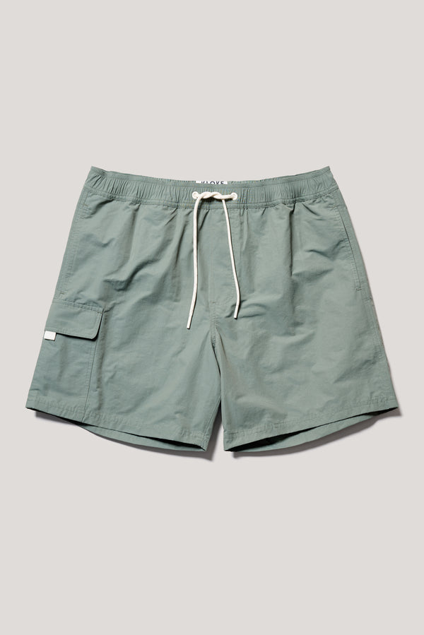 flat front of relaxed fit swim shorts in Olive green with an elastic drawstring waist and functional pocket detailing.