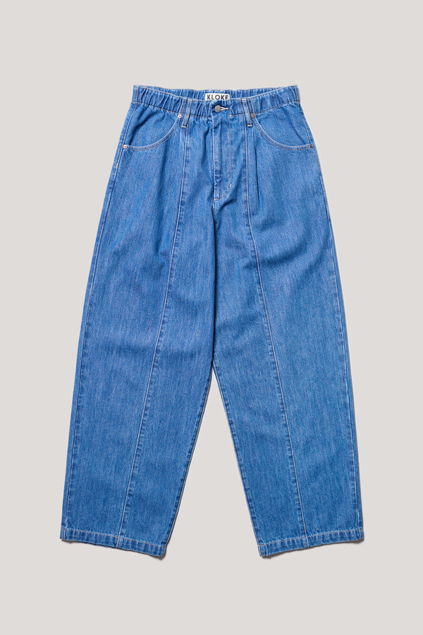 Flat Front of Impact Denim Pant in lightweight denim, front view showing wide tapered leg, elastic waistband, and traditional front pockets.