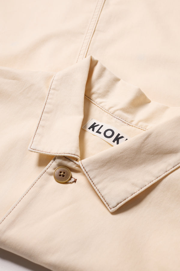 Close-up of Kloke Protocol Coverall in Ecru 100% cotton Denim, highlighting the  Built in Collar