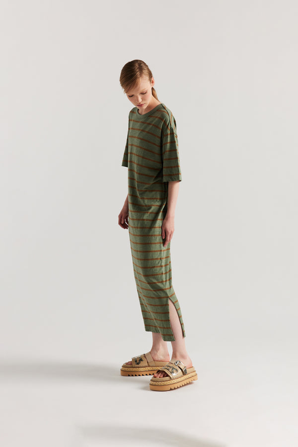 side of Model in the Olive/Brown Fidelity Dress in cotton slub with relaxed loose fit and feeder stripe