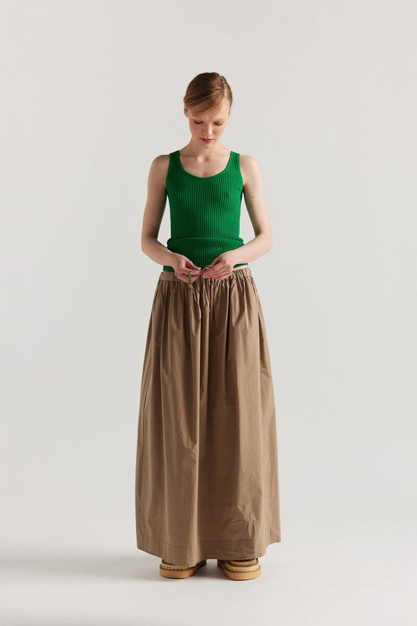 Front of Model wearing the green Duet Knit Singlet, showing the draped fit and textured knit.