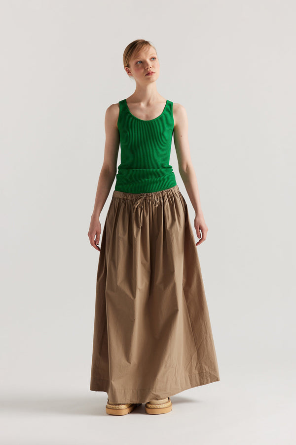 Front of Model wearing the green Duet Knit Singlet, showing the draped fit and textured knit.