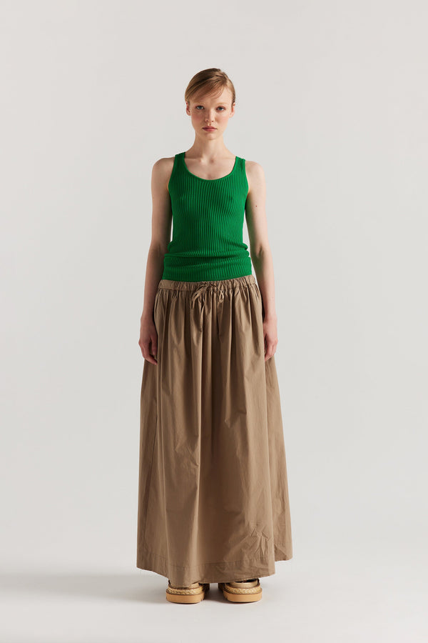 Front of Model wearing the green Duet Knit Singlet, showing the draped fit and textured knit.