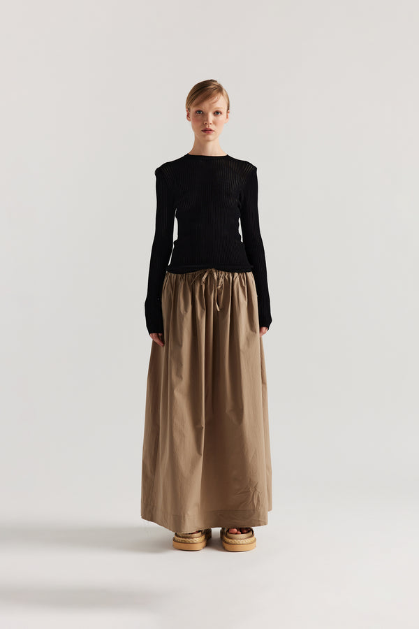 Front of model in Black Verse Knit Tee with subtle drop-stitch texture and fitted long-sleeve silhouette.