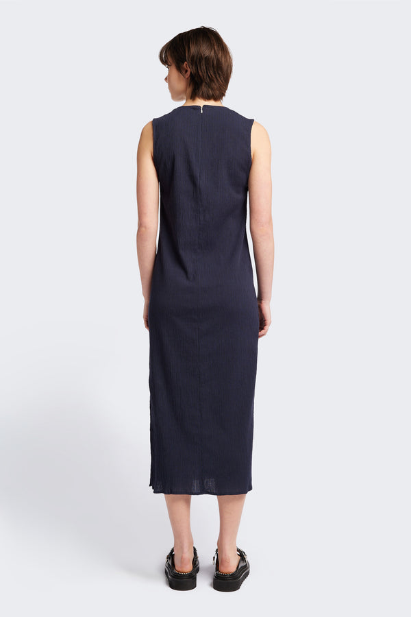 Back of The Level Crinkle Dress in Ink Navy Blue, a loose slim fit and stylish long length. Cut from lightweight crinkled crepe fabric this dress exudes everyday sophistication. Available in 4 sizes.