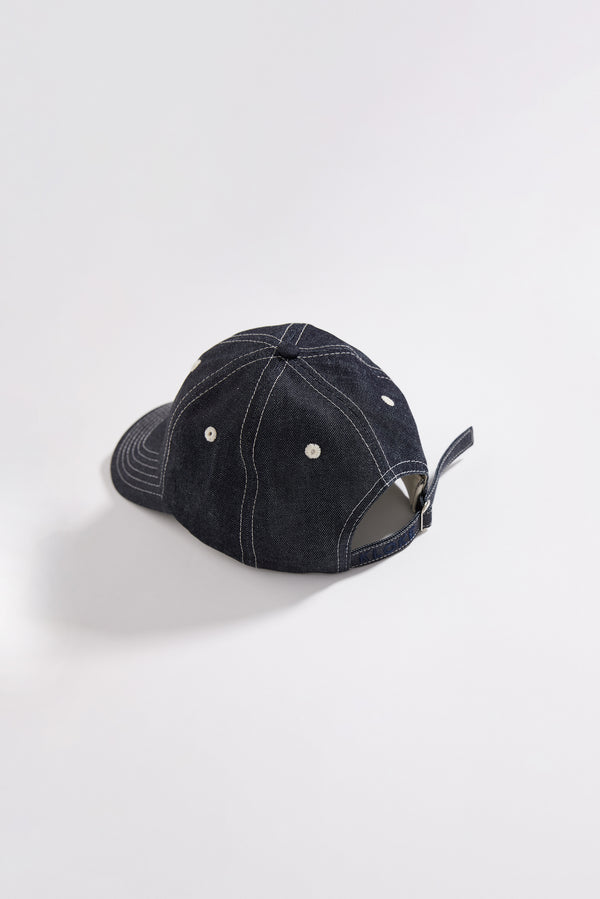 Back view of the five-panel denim cap featuring an adjustable strap with embroidered Kloke branding.