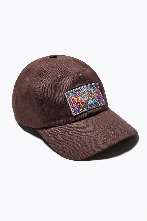 Unisex Cotton cap in Brown with Pfutze Aer Vital embroidered motif, adjustable fit with metallic buckle and ‘KLOKE’ embroidery on the strap. One Size.