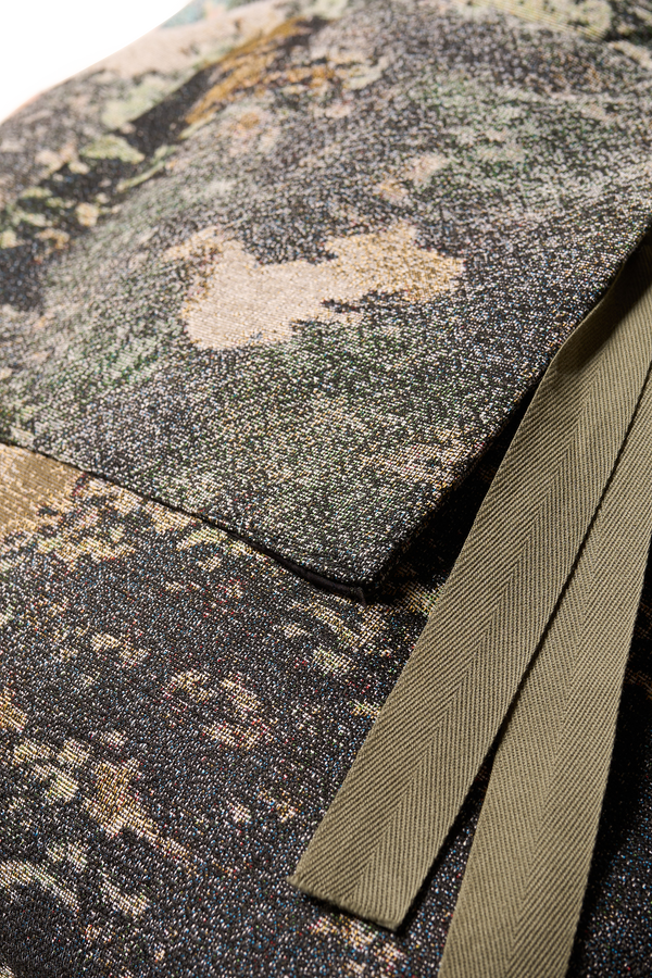 Close up fabric shot of Kloke jacquard tote bag in real tree camouflage green print with dual handle lengths and external pockets