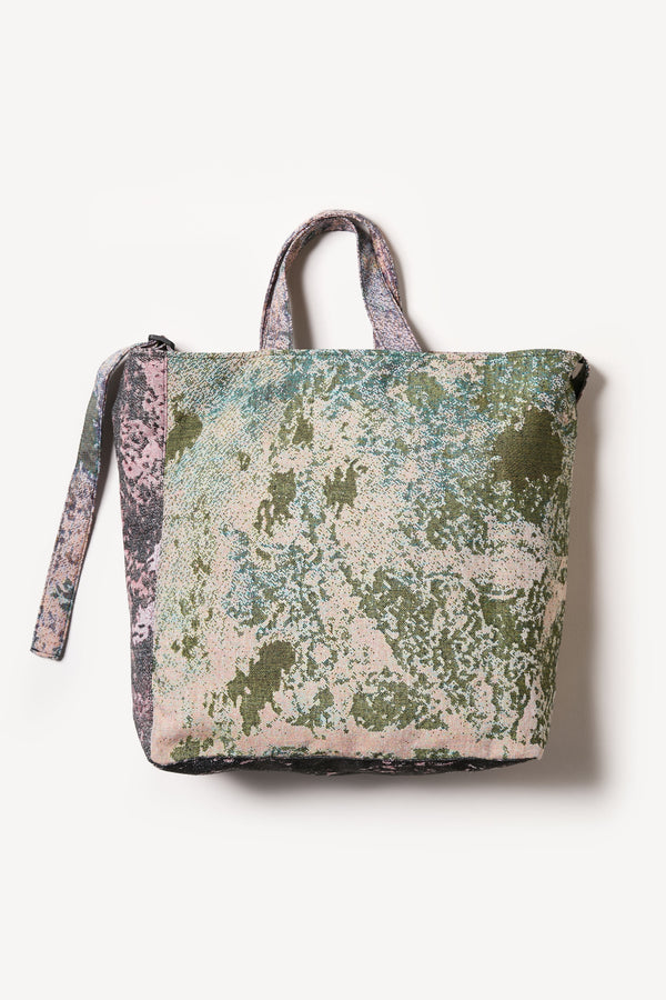 Flat Back of Kloke jacquard tote bag in real tree camouflage with dual handle lengths and external pockets 