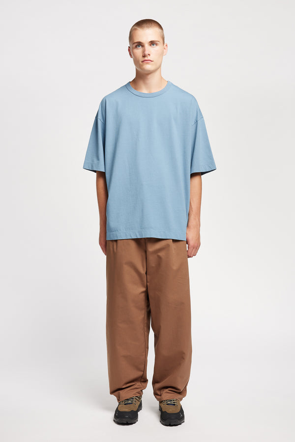 Men - front of model in Monolith Unisex Tee in Olive Oil.  Oversized relaxed fit. Available in 6 sizes. Made from 100% Organic Cotton 