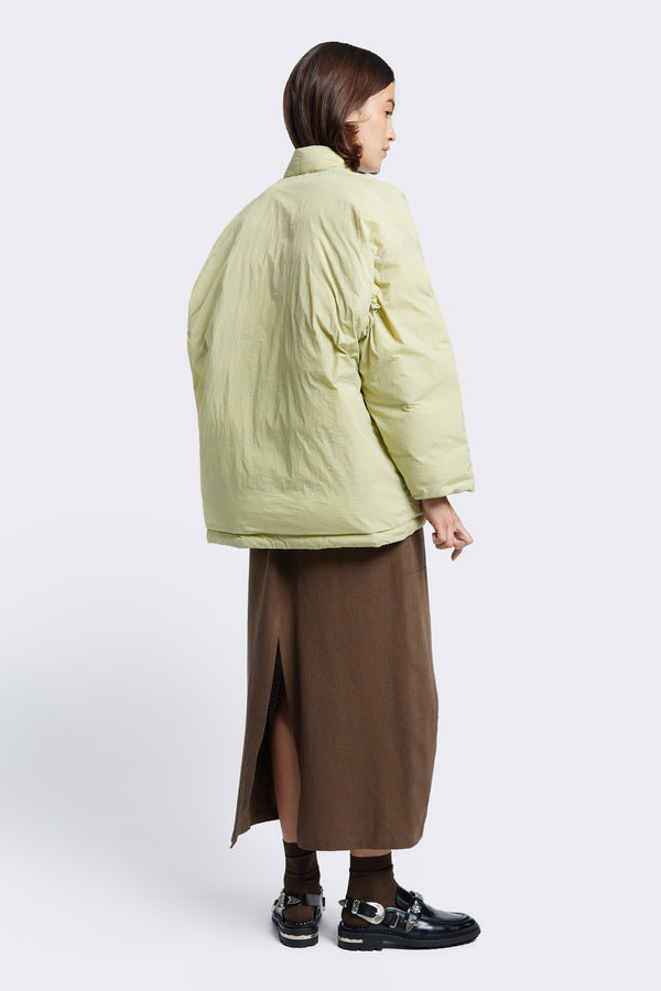 The back of the Abeyance Quilted Wrap Coat, a kimono style puffer jacket with a bagged out construction 