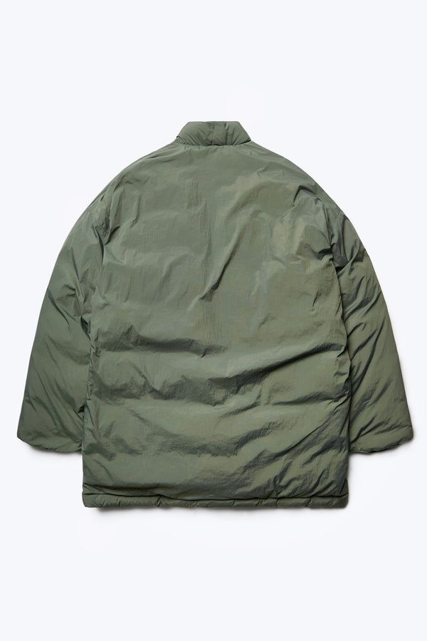 Flat lay of the back of the Abeyance Quilted Coat Olive made from 100% Recycled Nylon, Lining 100% Recycled Nylon, Fill 100% Post Consumer Down Fill
