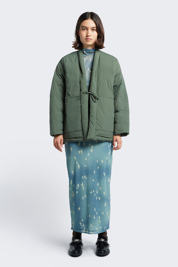 The Abeyance Quilted Wrap Coat Olive Green, a kimono style puffer jacket with centre tie and two front patch pockets. Available in five sizes. 