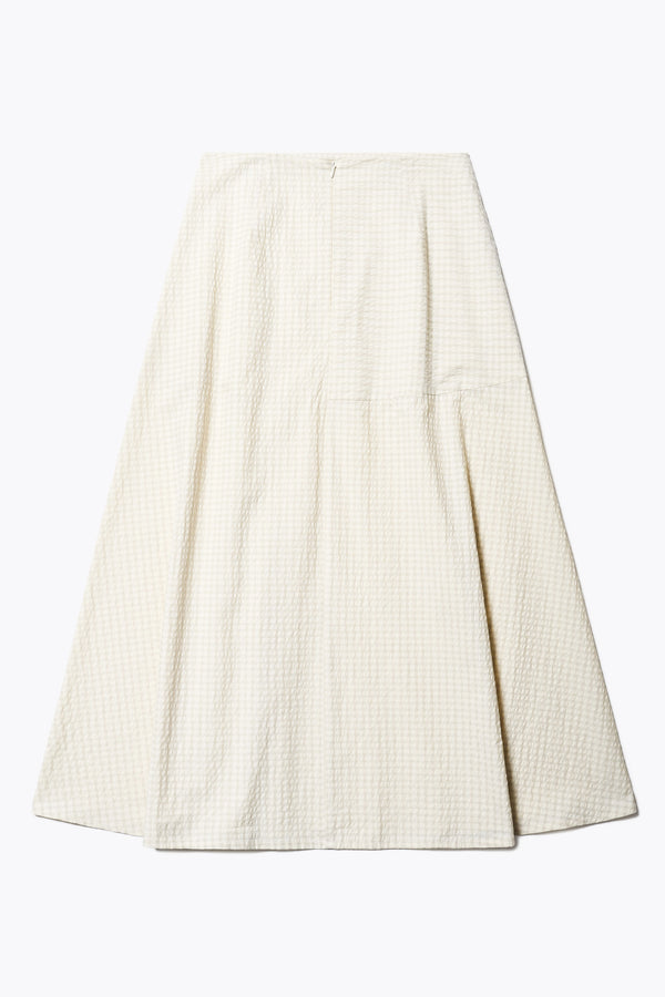 The back of the Abroad Panel Skirt, fitted at the waist with a bias-cut maxi silhouette, made from 100% cotton in Ecru Seersucker. Features panel details, side pockets, and an invisible back zip. Available in 6 sizes