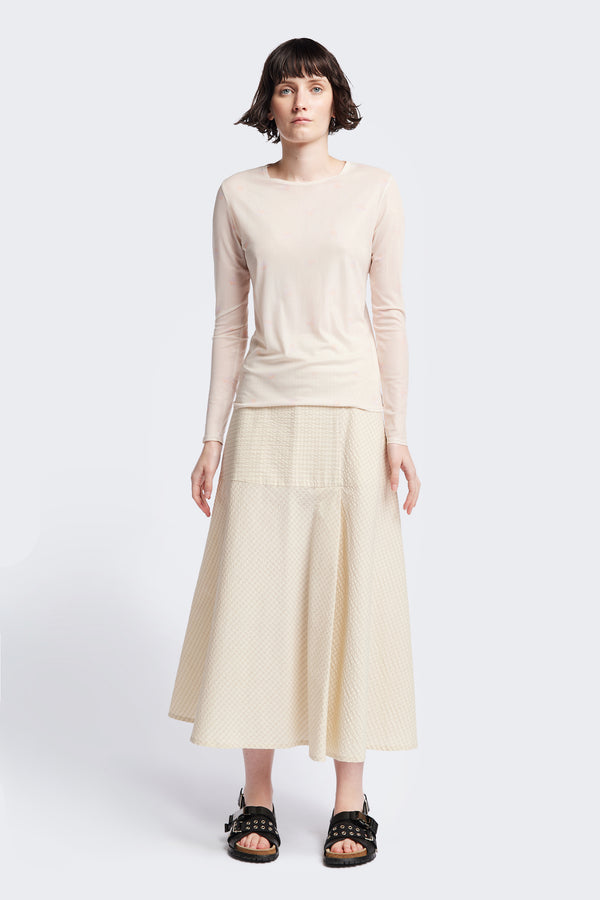 The Abroad Panel Skirt, fitted at the waist with a bias-cut maxi silhouette, made from 100% cotton in Ecru Seersucker. Features panel details, side pockets, and an invisible back zip. Available in 6 sizes