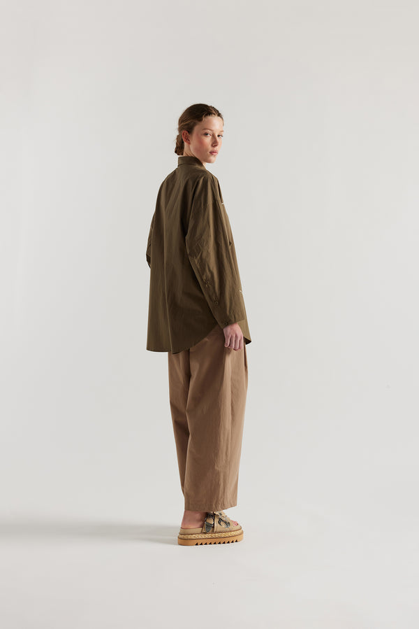 Olive green/brown Ache Embroidered Shirt back view on female model, with embroidered motifs, long sleeves, and built-in collar