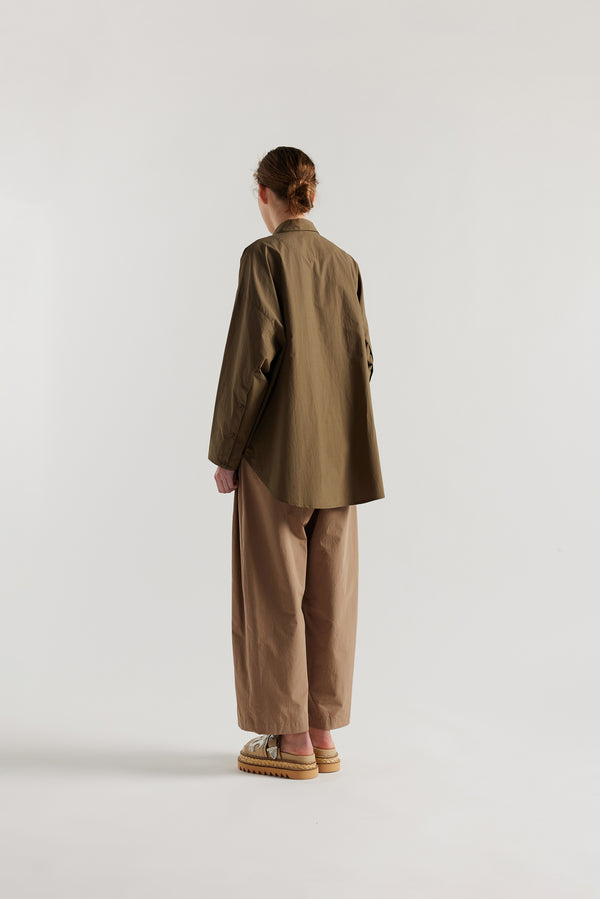 Olive green/brown Ache Embroidered Shirt back view on female model, with embroidered motifs, long sleeves, and built-in collar