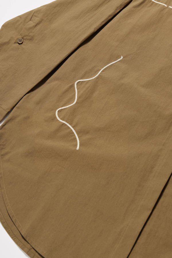 Close up fabric details shot of the Olive green/brown Ache Embroidered Shirt, with embroidered motifs, long sleeves, and built-in collar