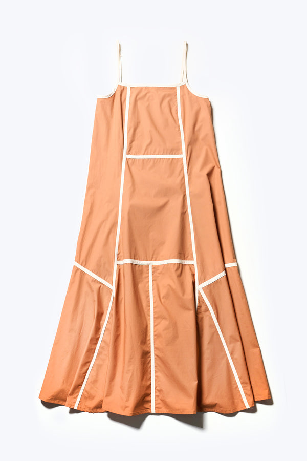 Flat Front of the Adjourn Dress in burnt orange/ecru, featuring contrasting block colours, bound seam details, adjustable thin straps, a straight neckline, and a flared A-line skirt. Available in 5 sizes. 