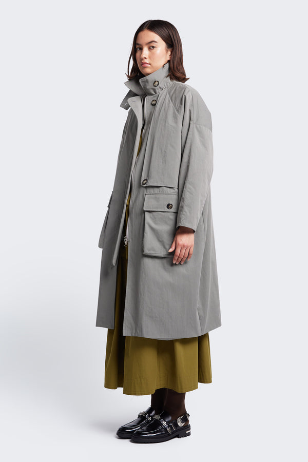 The Aegis Trench Coat Grey, a relaxed oversize trench coat. Available in five sizes. 