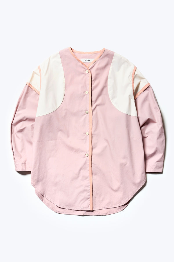 Flat Front of The Ages shirt in peach, a Patchwork-style shirt with block colours, bound seams, rounded neckline, centre front button opening, and rounded hemline, offering a relaxed, modern fit