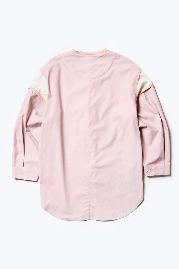 Flat back of The Ages shirt in peach, a Patchwork-style shirt with block colours, bound seams, rounded neckline, centre front button opening, and rounded hemline, offering a relaxed, modern fit