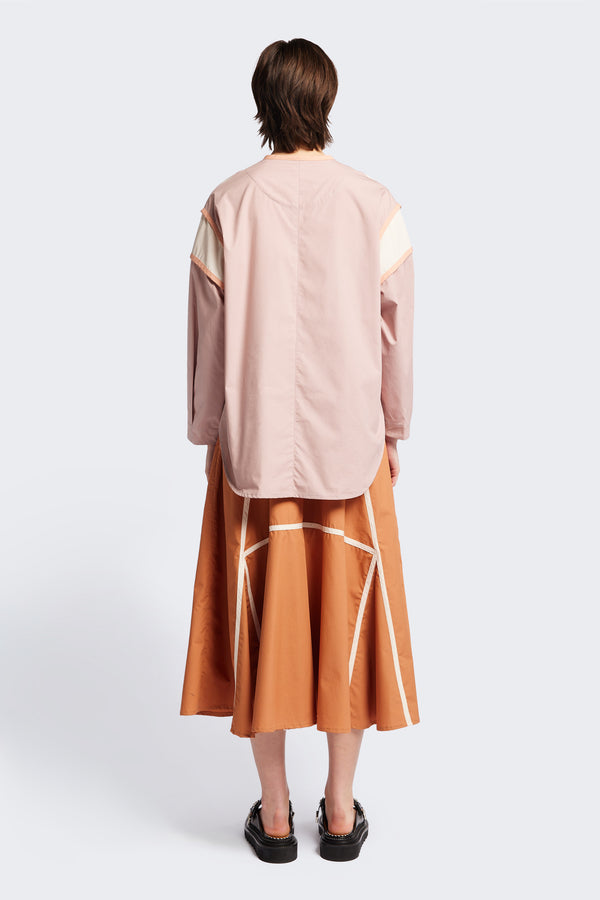 Back of The Ages shirt in peach, a Patchwork-style shirt with block colours, bound seams, rounded neckline, centre front button opening, and rounded hemline, offering a relaxed, modern fit