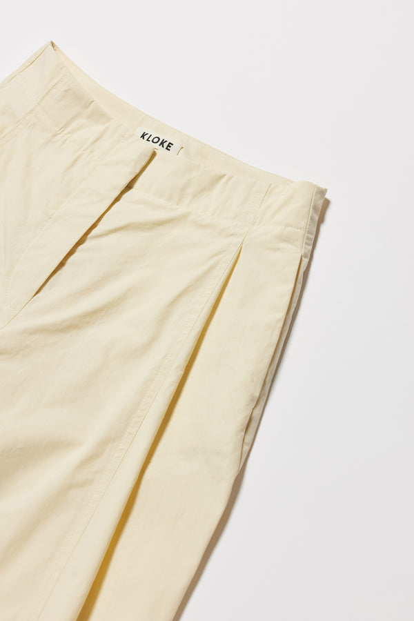 Close-up of waistband showing narrow finish and hook-and-bar closure.