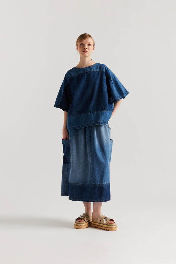 Front view of Dark/Mid Blue Fade Aria Panel Skirt showing panelled denim construction, scoop pockets, and elasticated waistband.