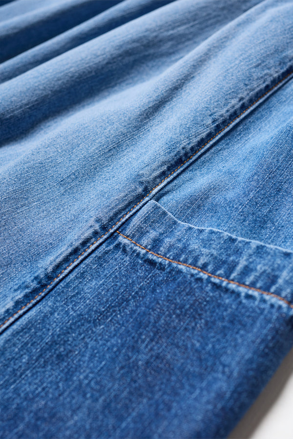 Close-up of Aria Panel Skirt scoop pocket and showcasing colour-faded denim.
