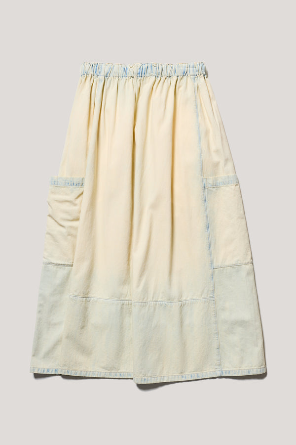 Flat back of Mid Blue Fade w Ecru Tint Aria Panel Skirt showing panelled denim construction, scoop pockets, and elasticated waistband.