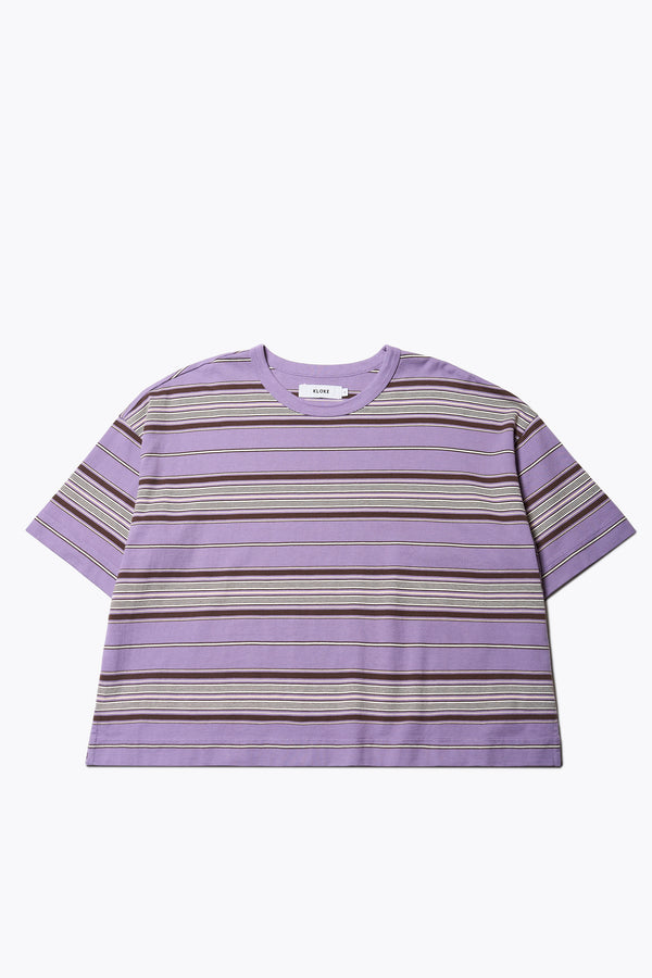 The Ascent T-Shirt , a relaxed, boxy top with elbow-grazing sleeves, featuring a Kloke-designed ticking stripe pattern in Purple. The top is made from 100% soft, durable combed cotton, balancing structure and drape. Available in 5 sizes.