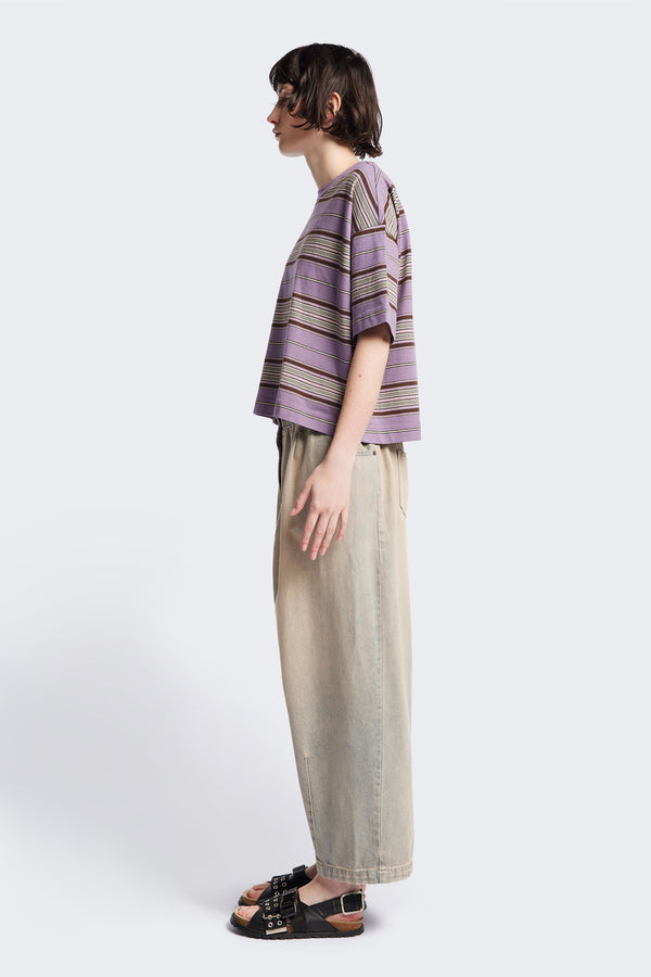 The Ascent T-Shirt side view, a relaxed, boxy top with elbow-grazing sleeves, featuring a Kloke-designed ticking stripe pattern in Purple. The top is made from 100% soft, durable combed cotton, balancing structure and drape. Available in 5 sizes.