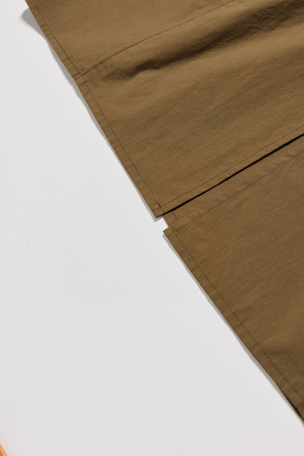 Close up details of the white Aureole Dress front view showing the split hem