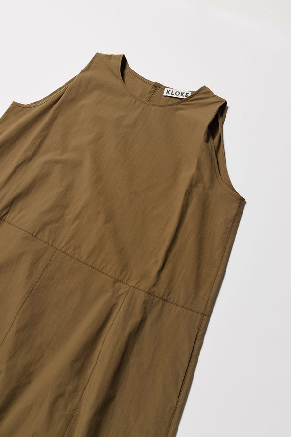 Close up details of the olive Aureole Dress front view showing panelled detailing 