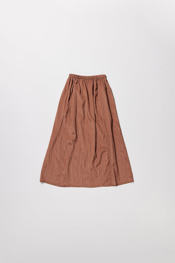Flat back of the brown Calm Skirt with panelled construction, scoop pockets and elasticated drawcord waistband in lightweight textured fabric.