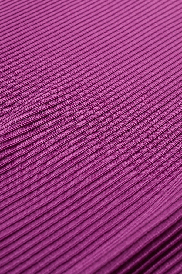 Celsius Knit T-Shirt in Fuchsia Pink close up of fabric, ribbed with a shallow scoop neckline, small cap sleeves, and slim fit. Made from 100% Tencel. Available in 5 sizes. 