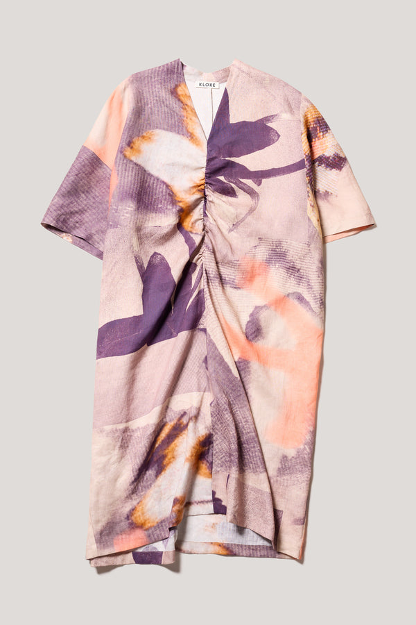 Flat front of the Chaos dress a relaxed V-neck linen dress in the Kloke Custom Chaos print, gathered at the centre front.  