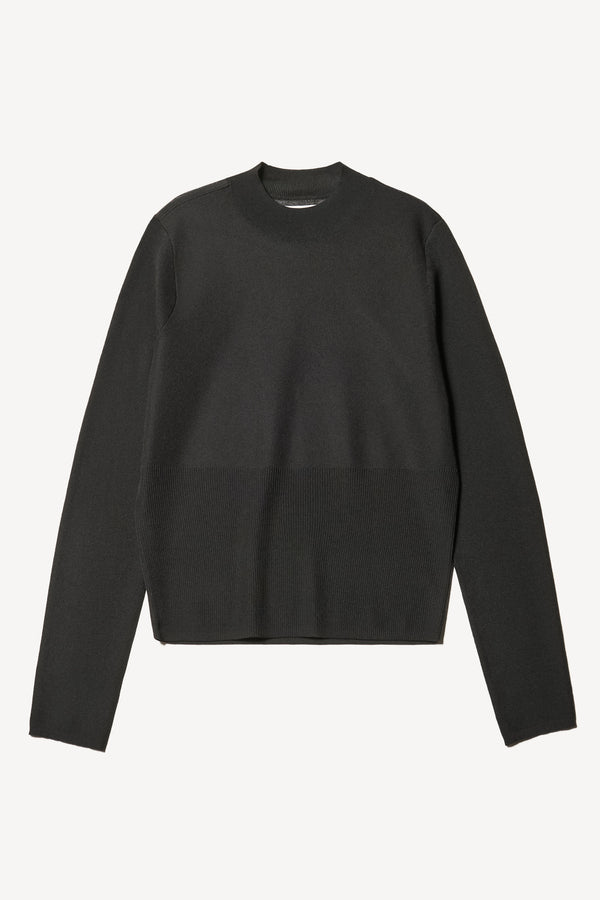 Flat Front view of the Clarity fitted crew-neck knit top in Black