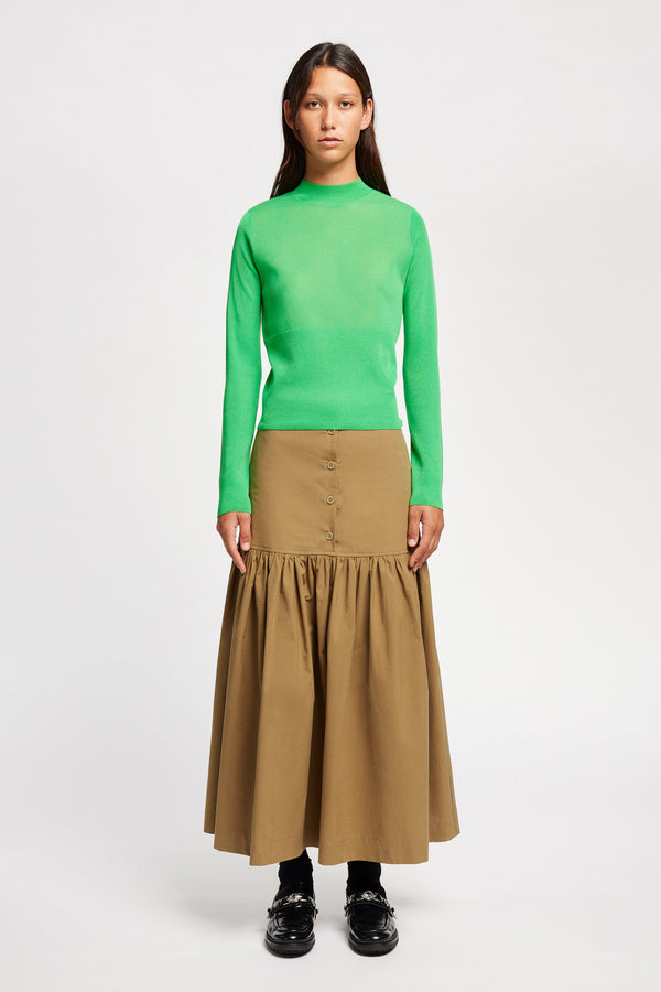 Front view on Model of the Clarity fitted crew-neck knit top in Vivid Green 