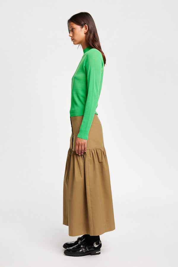 Side view on Model of the Clarity fitted crew-neck knit top in Vivid Green 