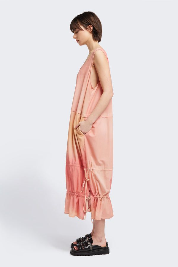 Side view of the cloud dress in Kloke designed cloud print, a relaxed-fit sleeveless dress featuring wide shoulder straps and a scoop neckline.