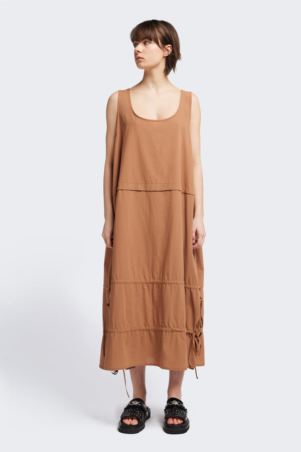 Front view of the cloud dress in toffee brown, a relaxed-fit sleeveless dress with wide shoulder straps, a scoop neckline.