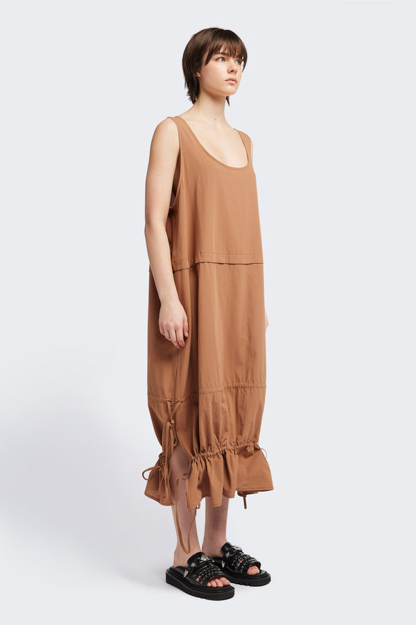 Front view of the cloud dress in toffee brown, a relaxed-fit sleeveless dress with wide shoulder straps, a scoop neckline.