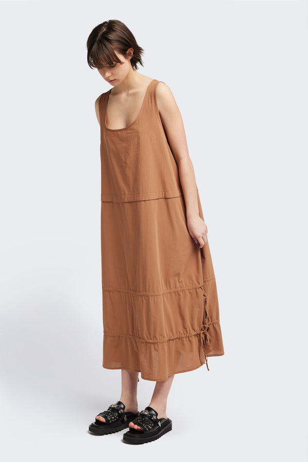 Front view of the cloud dress in toffee brown, a relaxed-fit sleeveless dress with wide shoulder straps, a scoop neckline.