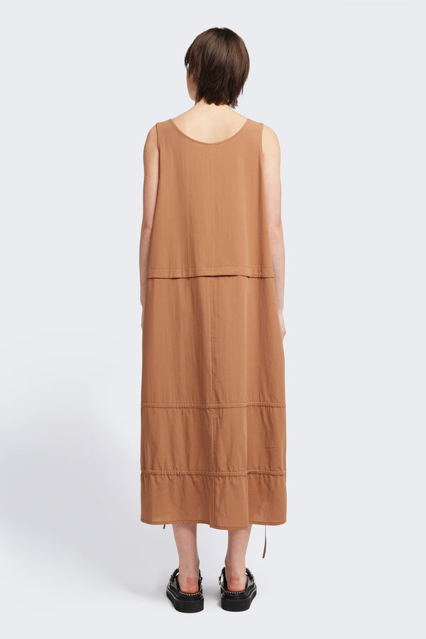 Back view of the cloud dress in toffee brown, a relaxed-fit sleeveless dress with wide shoulder straps, a scoop neckline.