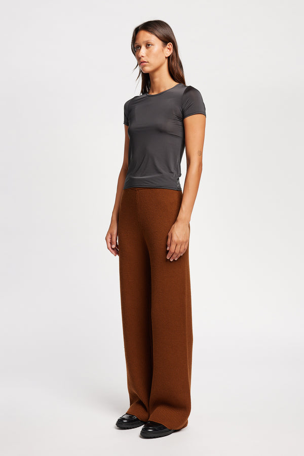 Front view on model of the Jet Black Convoy fitted short sleeve top with crew neckline, crafted in soft sheen recycled poly fabric