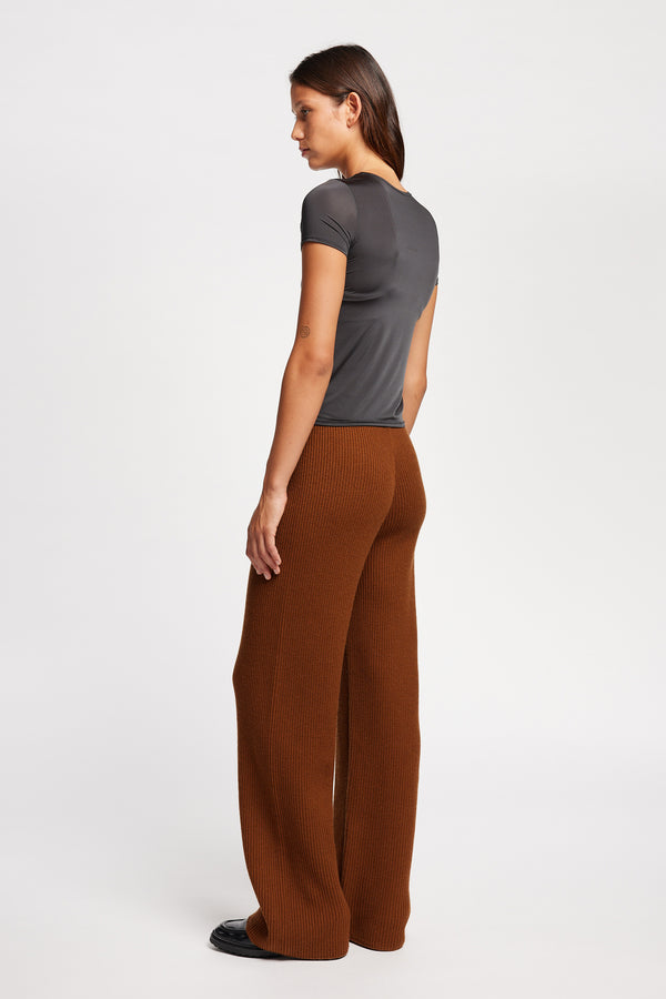 Front view on model of the Jet Black Convoy fitted short sleeve top with crew neckline, crafted in soft sheen recycled poly fabric