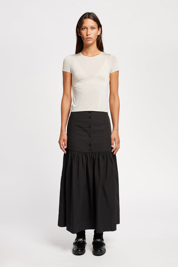 Front view on model of the off white Convoy fitted short sleeve top with crew neckline, crafted in soft sheen recycled poly fabric